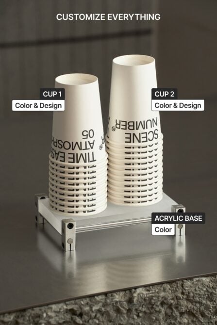 Two cream paper cups on metal base with labels showing color customization options