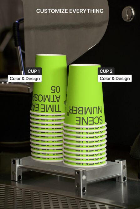 Stacked lime cups on metal display stand with dark studio background