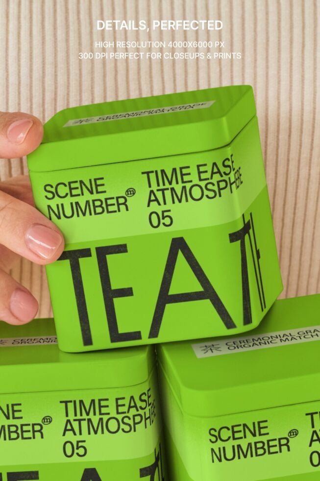 Hand peeling back corner of bright green tea box to reveal inner detail