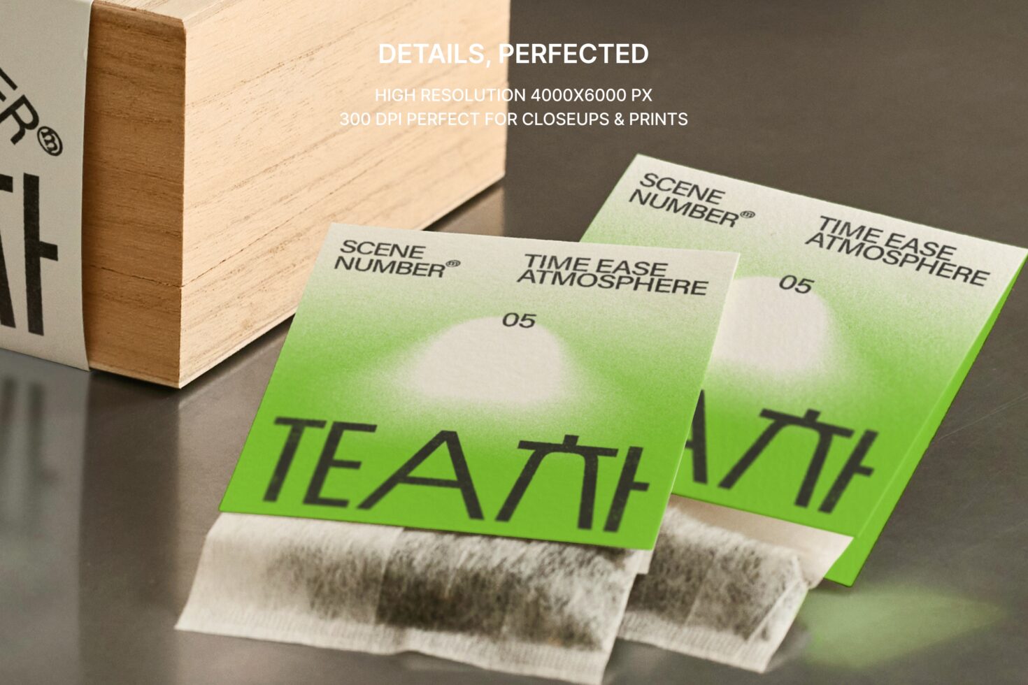 Wooden box corner with fanned green tea bag sachets in detail view