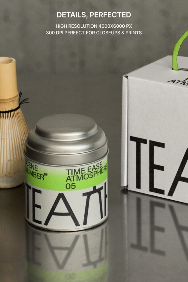 Close up of metal tea canister with lime green band label on concrete