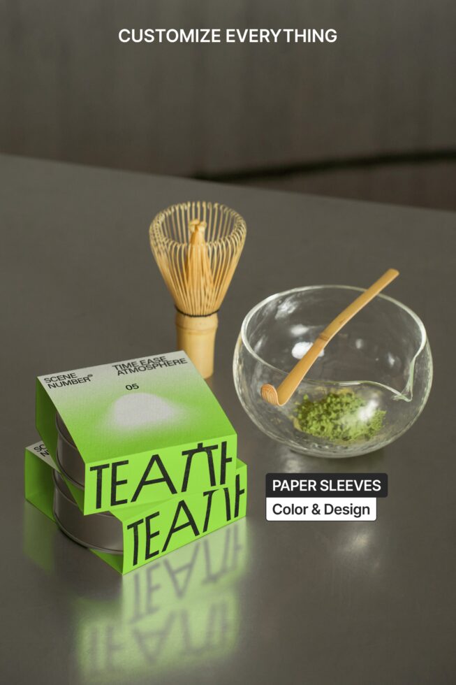 Branded paper box sleeve wrapping around glass bowl with matcha, wooden tools displayed