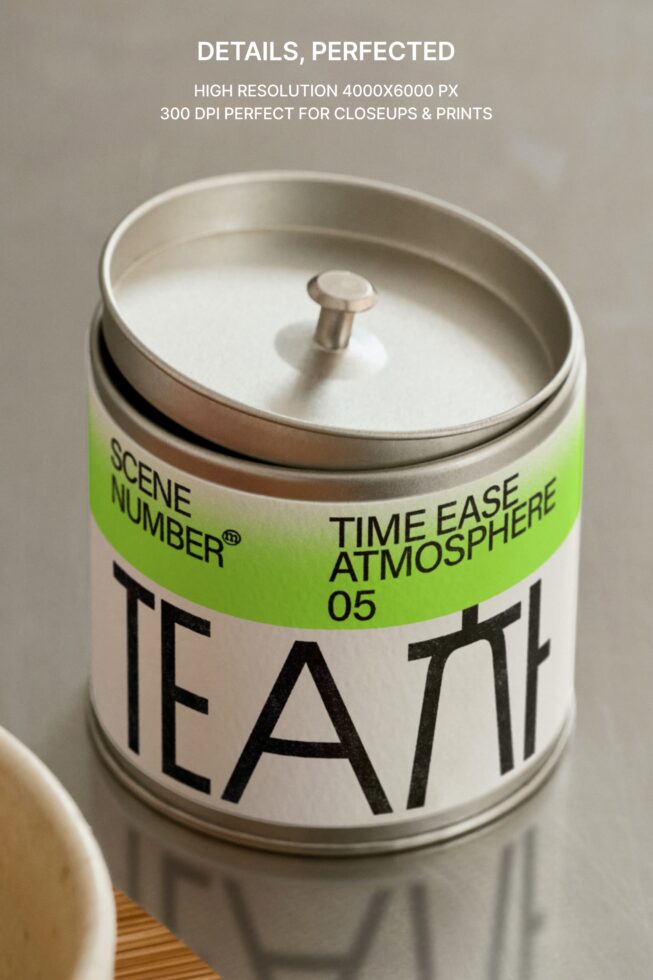 Top view white tea candle with bright green band, metal lid visible clearly