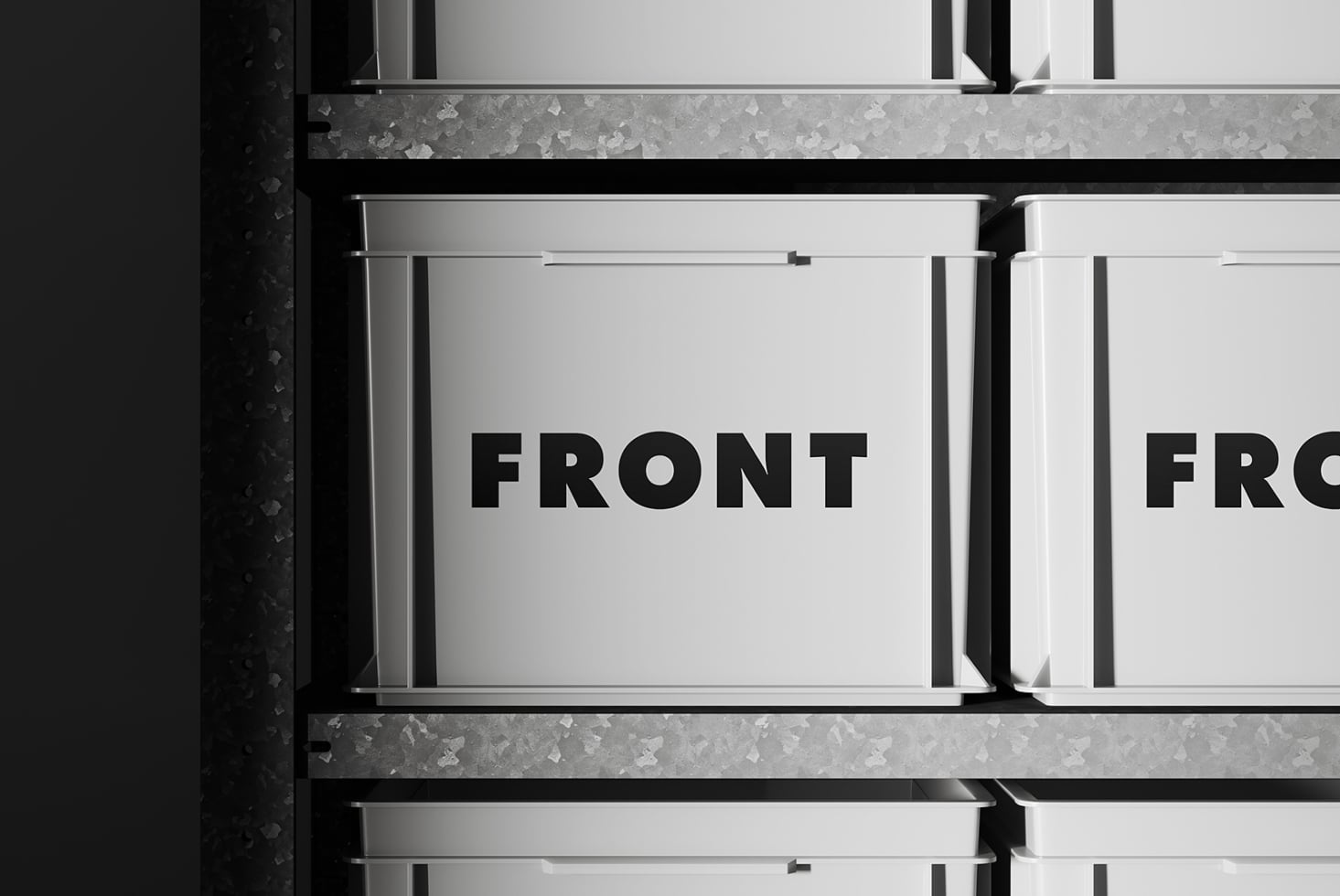 White metal boxes with black text on industrial concrete wall