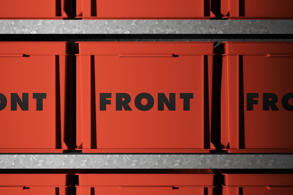 Bright red stacked boxes with black text in studio lighting setup