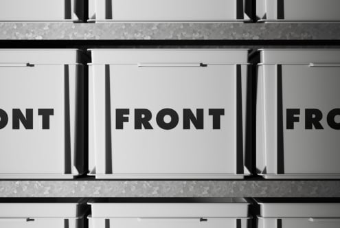 White stacked boxes with black text on clean minimalist backdrop