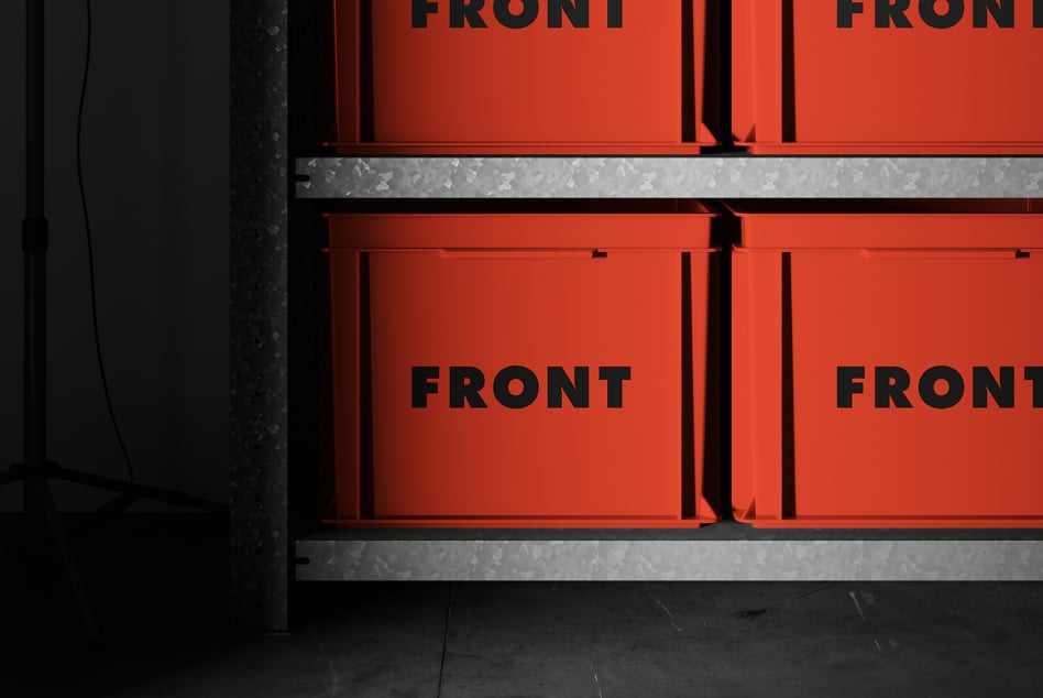Stacked red industrial boxes with black text on dark background