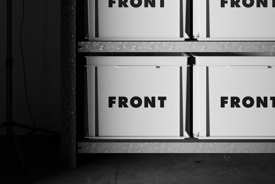 White retail boxes on industrial shelving with editable front panel