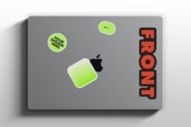 MacBook laptop with green sticker mockup on gray background showing FRONT text