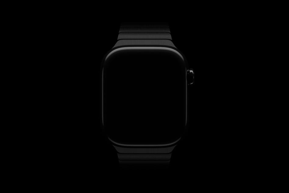 Black smartwatch with blank dark screen centered on black background