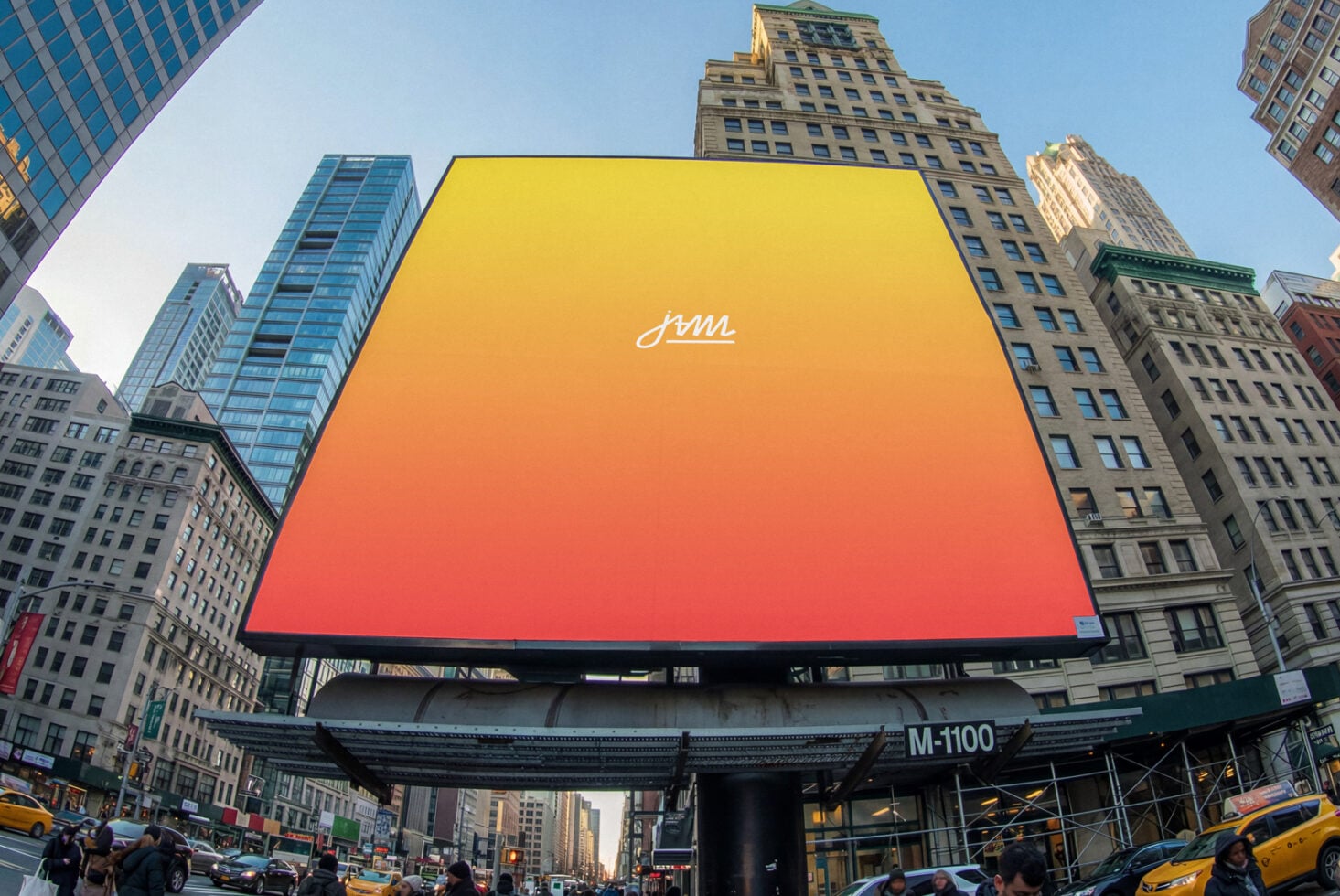 Giant billboard in Times Square showing gradient yellow to red with JAM logo