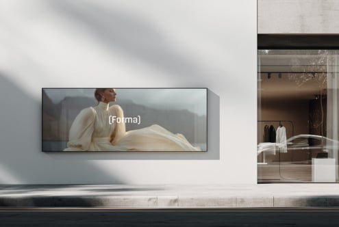 Woman in cream dress flowing fabric shown on wide horizontal storefront screen display