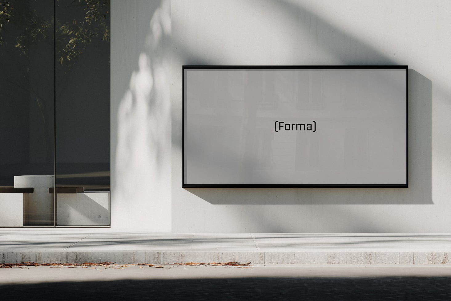 Blank wide monitor mockup on bright white wall with dramatic shadow