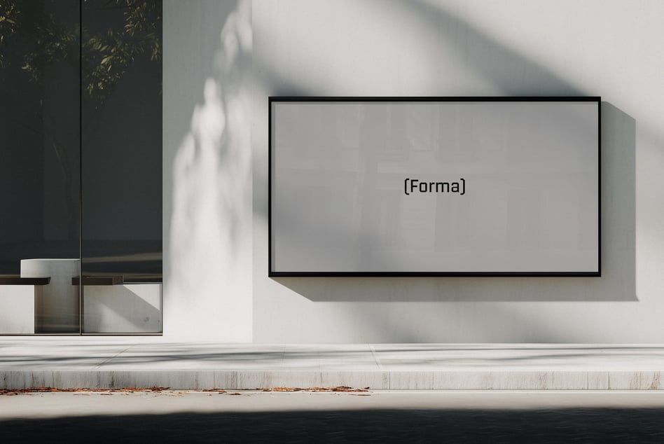 Blank wide monitor mockup on bright white wall with dramatic shadow