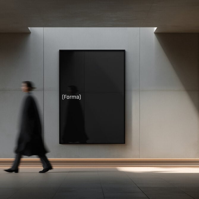Black framed poster mockup on gallery wall with person walking past
