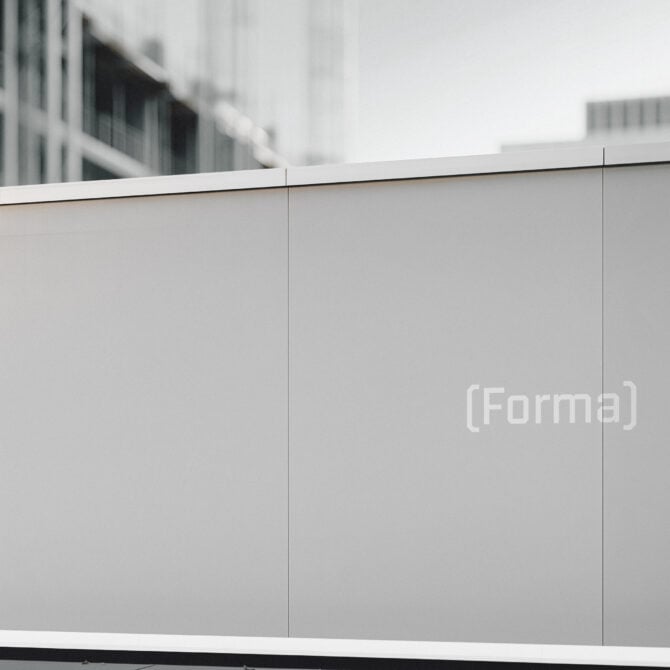 Empty outdoor advertising space with (Forma) text on dark panel, modern urban setting