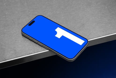 Smartphone displaying Facebook blue interface with white logo centered