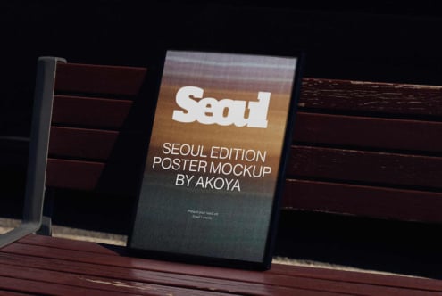 Seoul Edition poster mockup on bench featuring white typography over gradient background