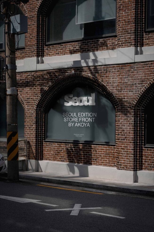 Brick storefront with arched window showing interior signage