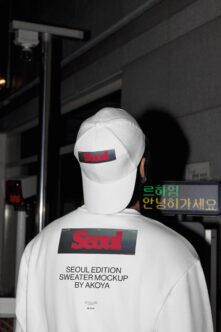 Person wearing white sweater cap with Seoul Edition mockup branding from behind