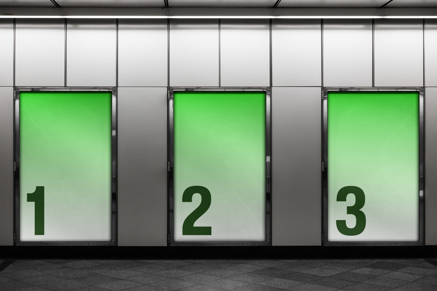 Three green gradient light box displays numbered 1 2 3 in subway station