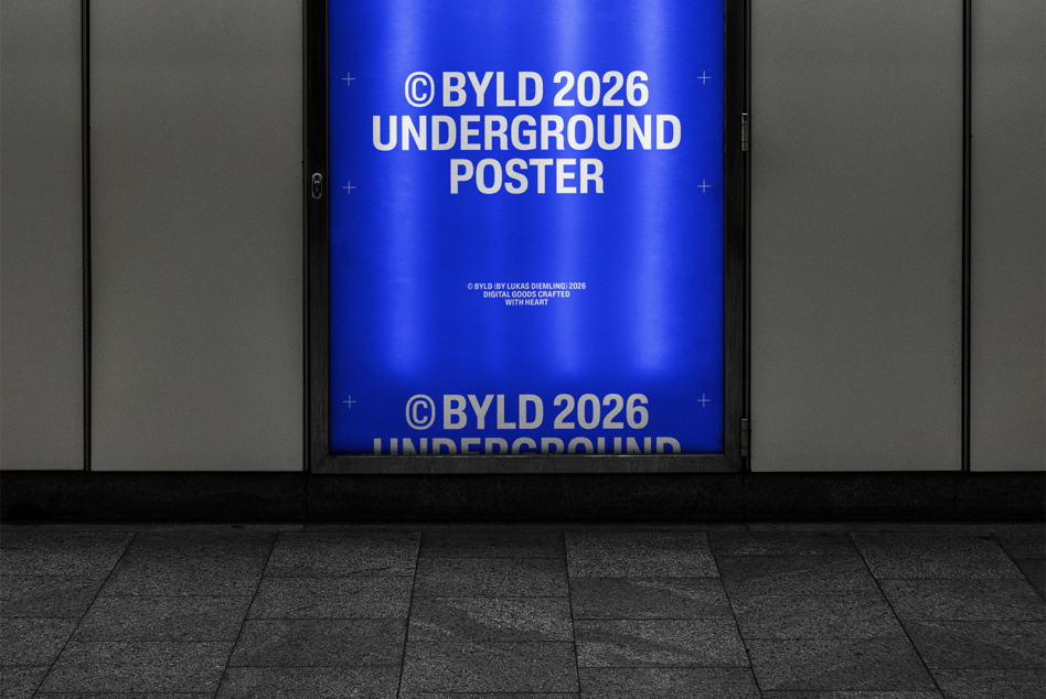 Bright blue glowing poster display in dark subway station with bold white typography