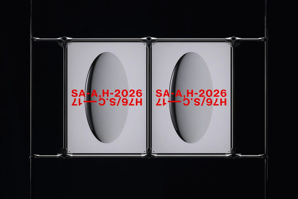 Metal clamp frame displaying two red text posters against dark backdrop