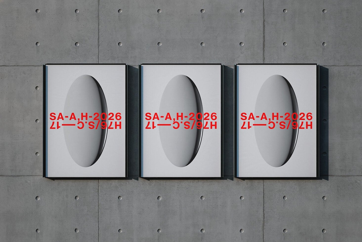 Three framed prints showing 3D spheres with red text overlay on concrete