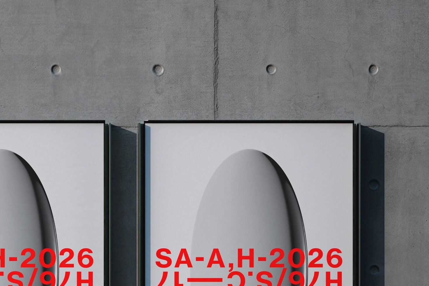Two outdoor billboards with black frames mounted on concrete wall showing red typography
