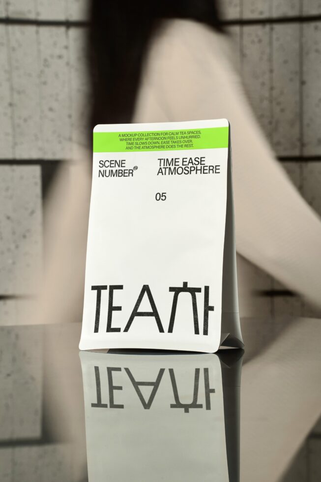 White top panel tea box mockup angled view with mug, sunlit background