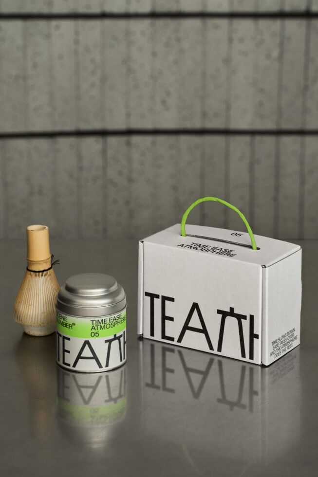 Matcha whisk, metal tea canister with green band, white box with green handle