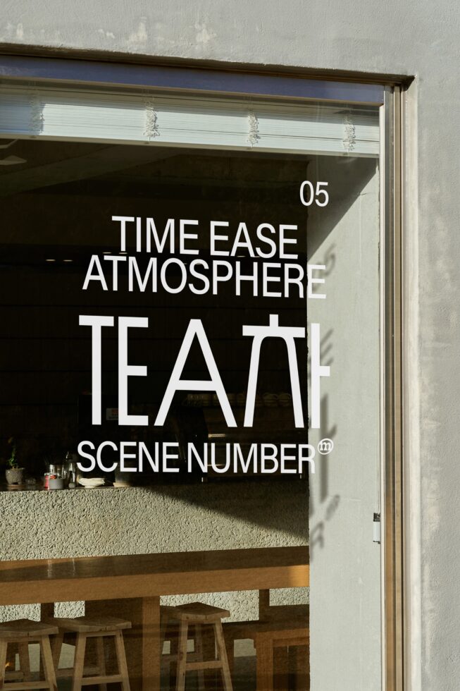 Window storefront displaying oversized white typography on black background