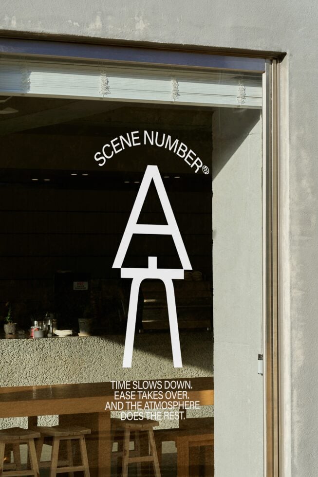 Window signage mockup with white Scene Number branding displayed