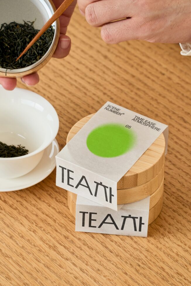 Tea packaging mockup stacked with loose leaf tea overhead shot