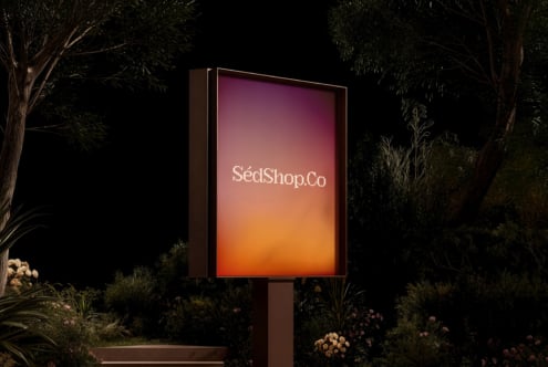 Neon-style outdoor signage displaying SédShop.Co with pink-to-orange color transition