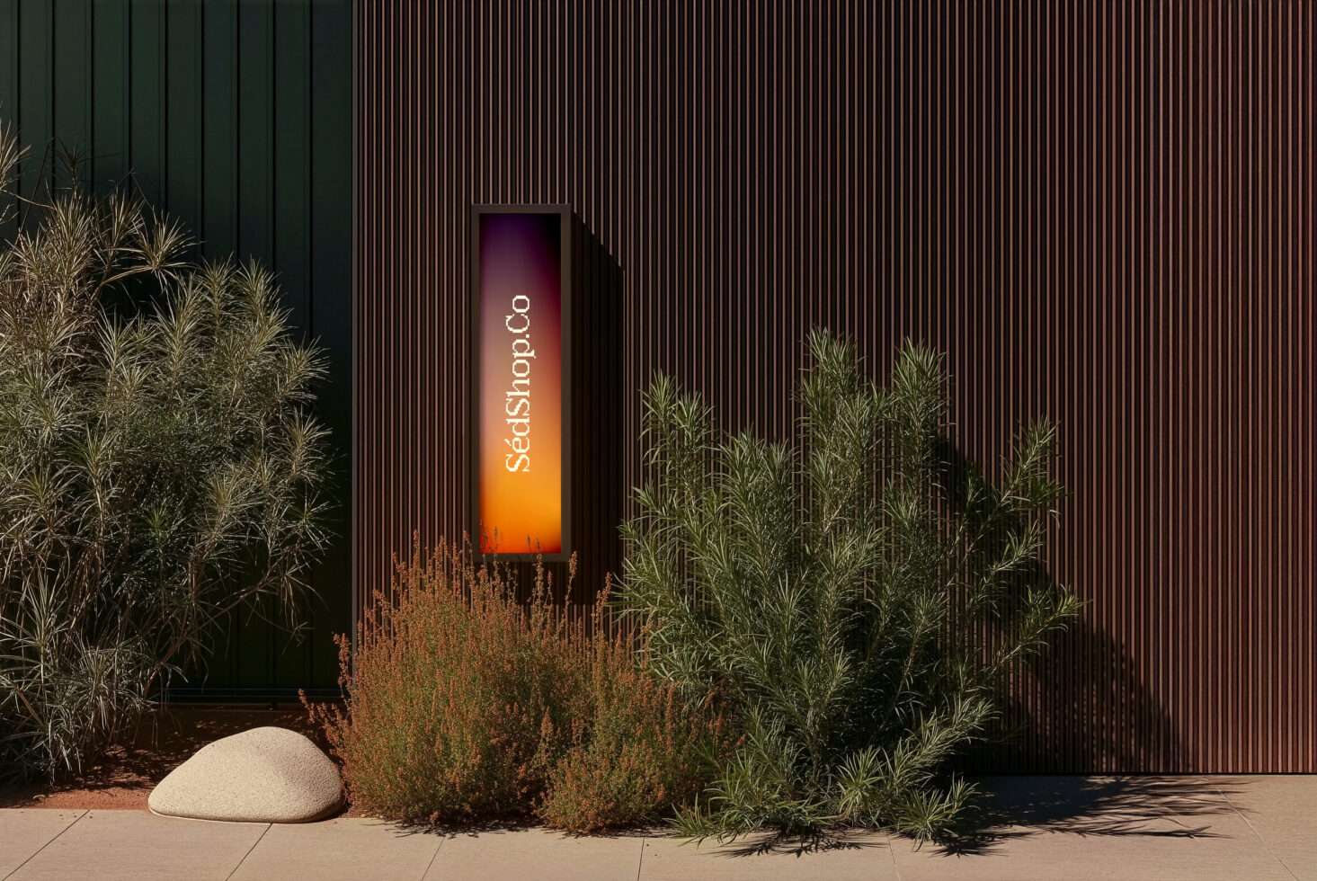 Vertical signage with orange gradient glow, planted greenery, concrete base on industrial wall