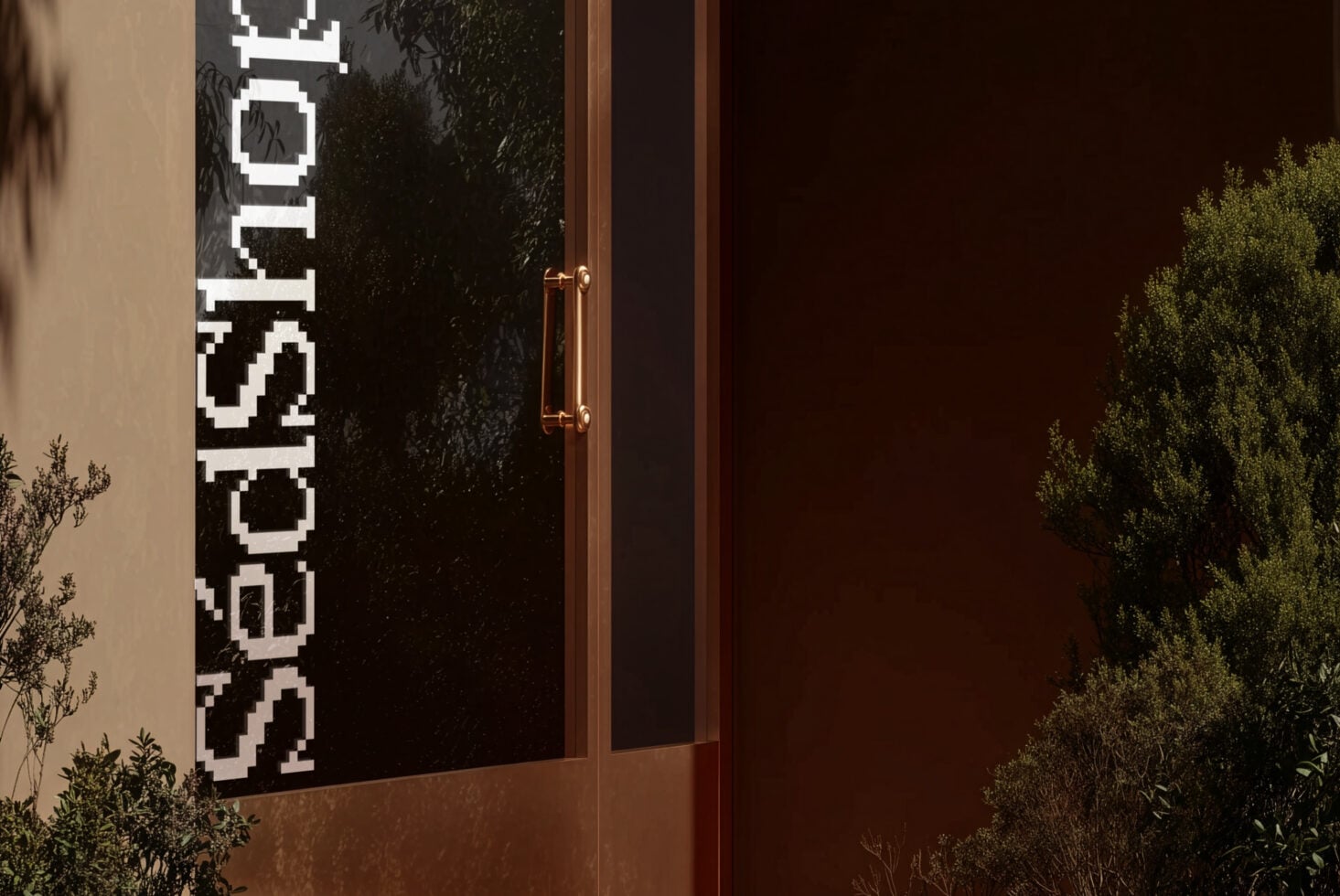 Bold vertical SedShop.Co pixelated lettering on black glass storefront lower section
