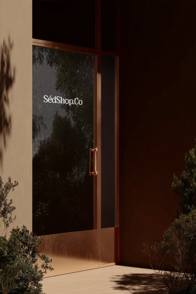 Minimalist glass door with SedShop.Co type centered on dark textured surface