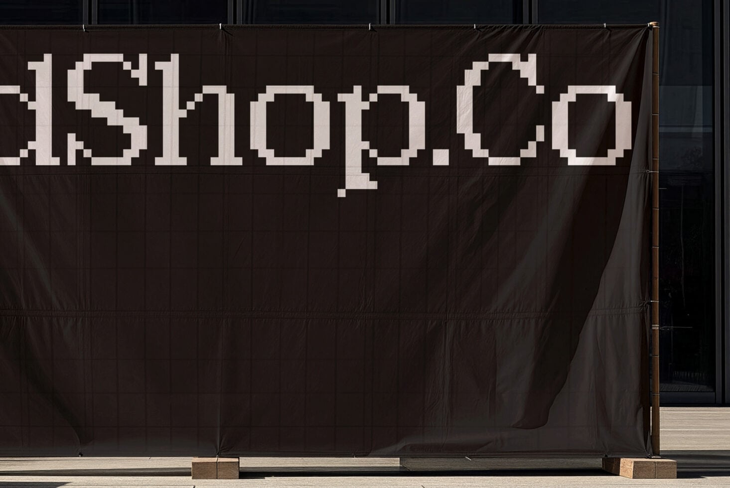Chunky pixel font numbers on dark brown fabric sign with gold frame details