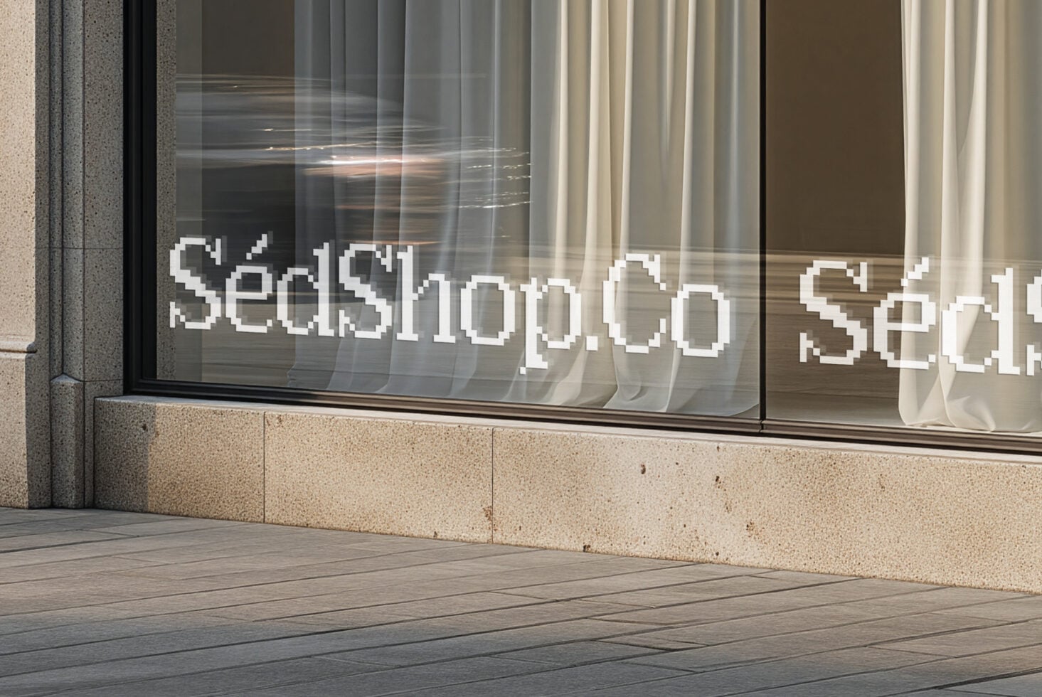 Storefront window with pixelated white text on glass, neutral tones, concrete facade