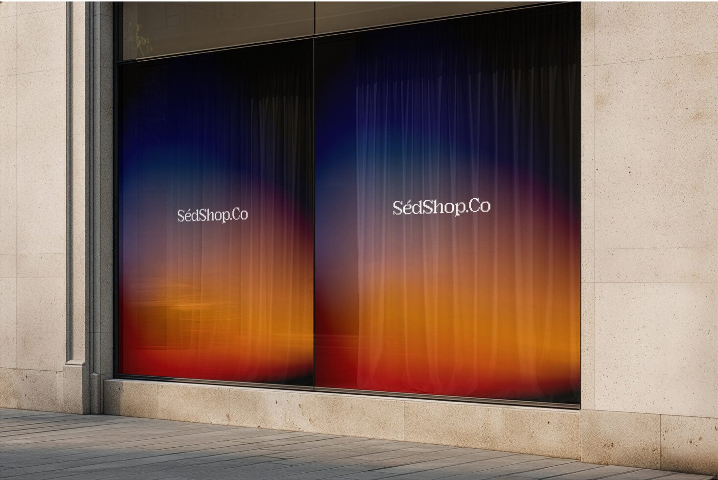 Storefront glass with dark background transitioning to warm orange glow, white serif text