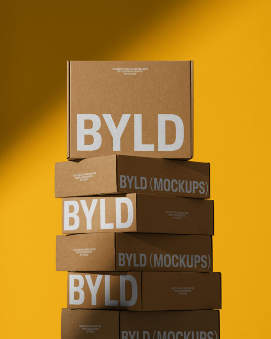 Kraft cardboard boxes stacked with BYLD branding on yellow background