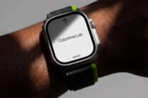 Smartwatch on wrist with bright neon band showing light colored screen