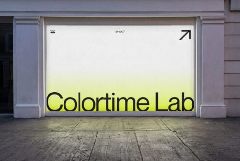 Large storefront display with Colortime Lab text in black on gradient yellow background