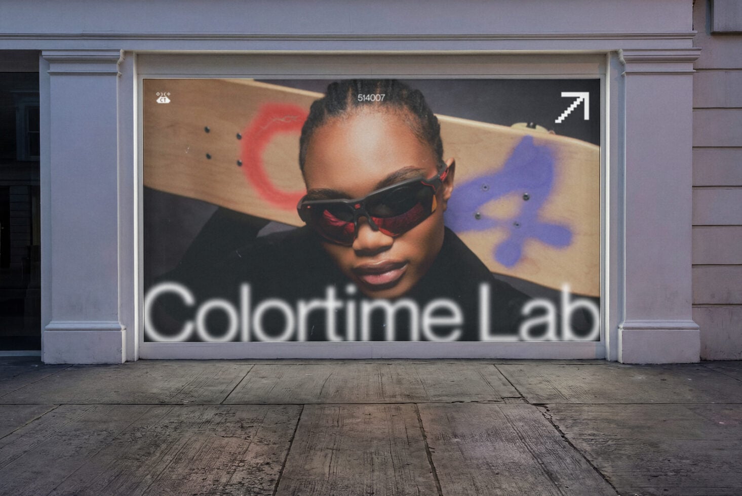 Storefront window showing woman in sunglasses with colorful paint swatches behind Colortime Lab text