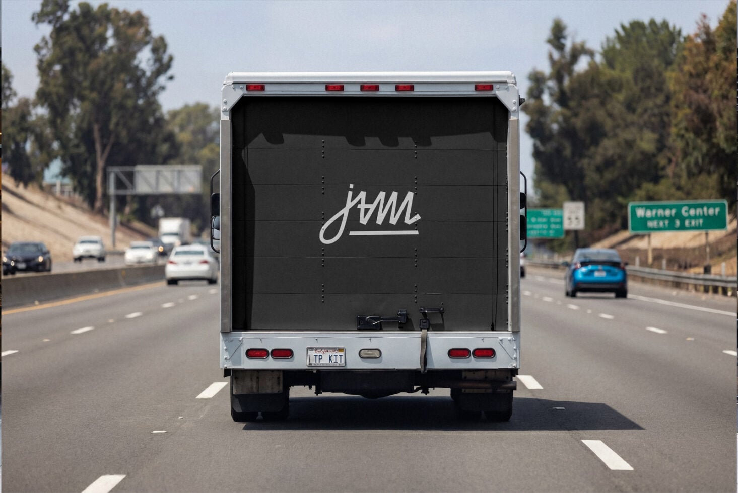 Delivery truck rear on highway with black box design mockup