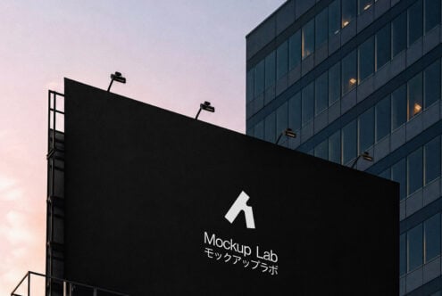 Large billboard mockup with logo displayed against urban building backdrop at dusk