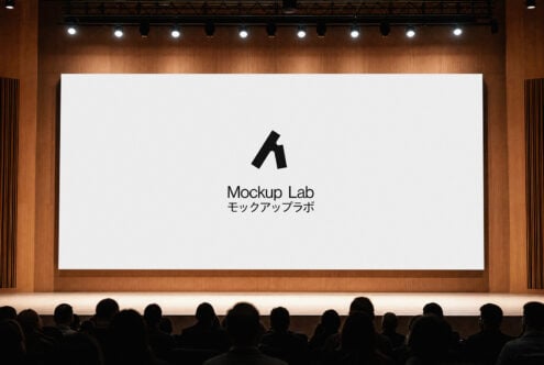 Large cinema screen displaying Mockup Lab logo in warm wood interior with crowd