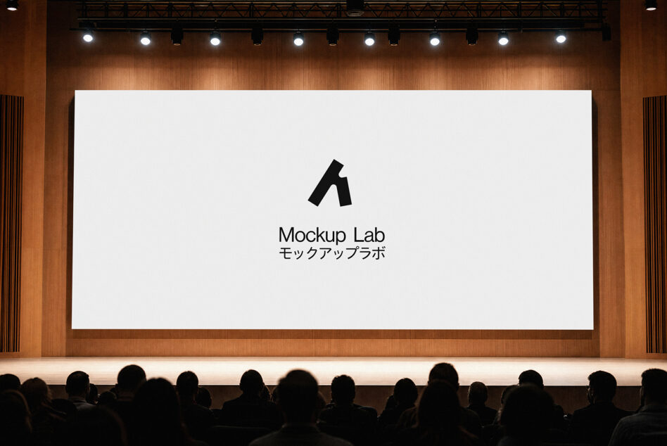 Large cinema screen displaying Mockup Lab logo in warm wood interior with crowd