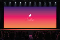 Cinema screen mockup with vibrant gradient backdrop, audience silhouettes, stage lights overhead